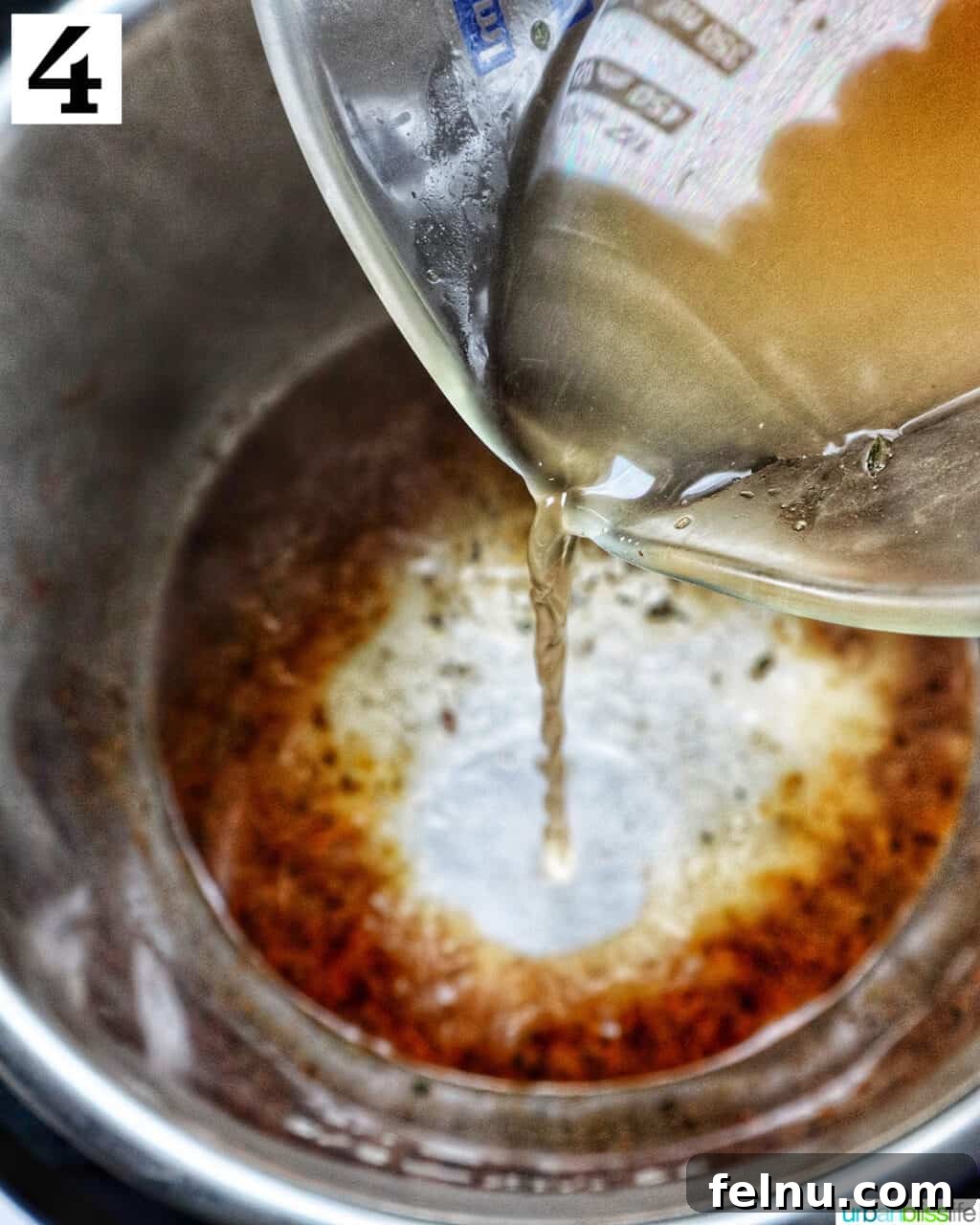 Instant Pot Chicken Legs 10 Deglazing the Instant Pot with chicken broth.