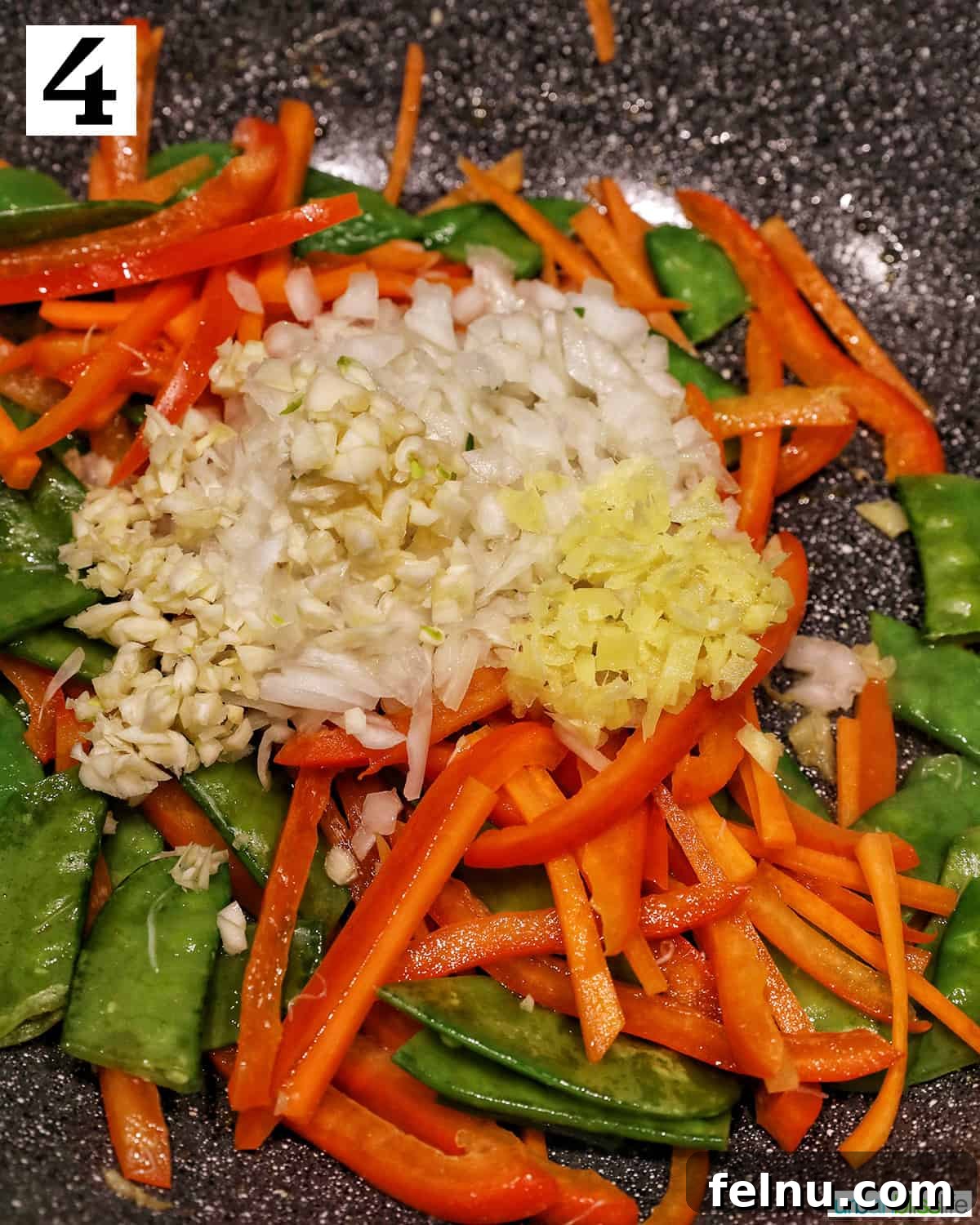Crab Noodle Stir-Fry 9 Adding Garlic and Onions to Vegetables