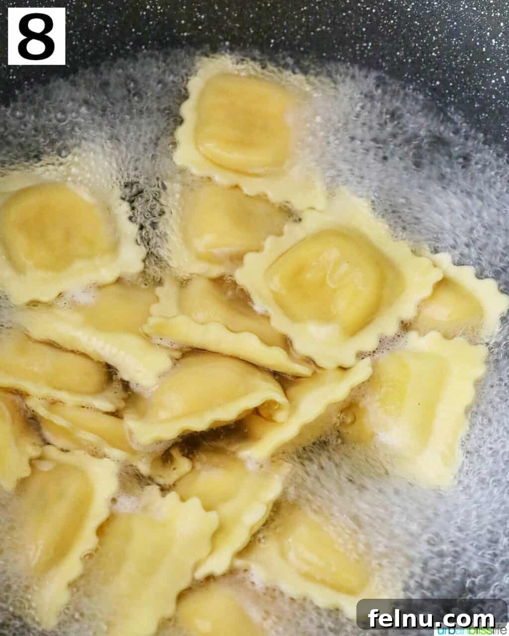 Cooking lobster ravioli in boiling water.