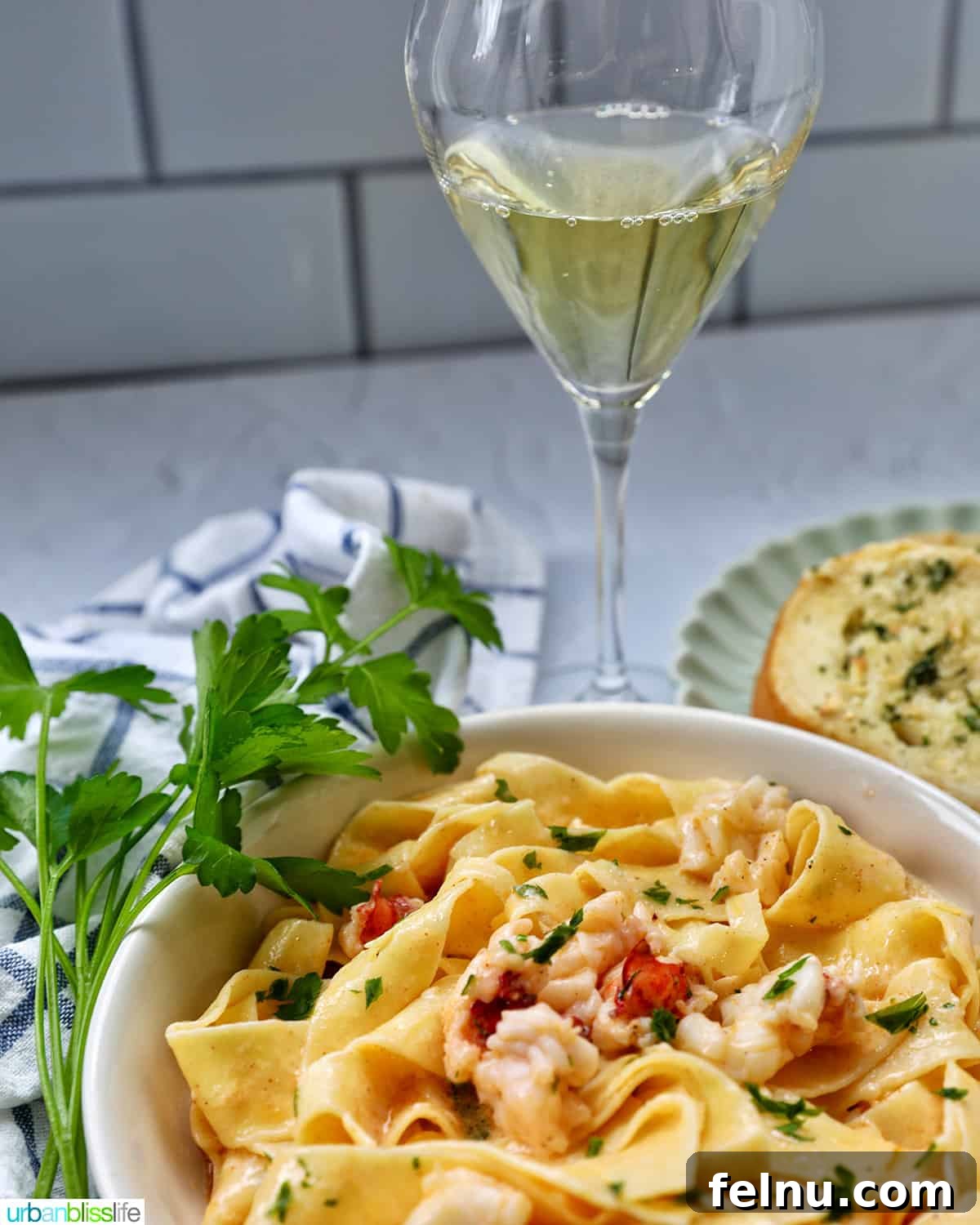 Lobster pasta with a glass of white wine.