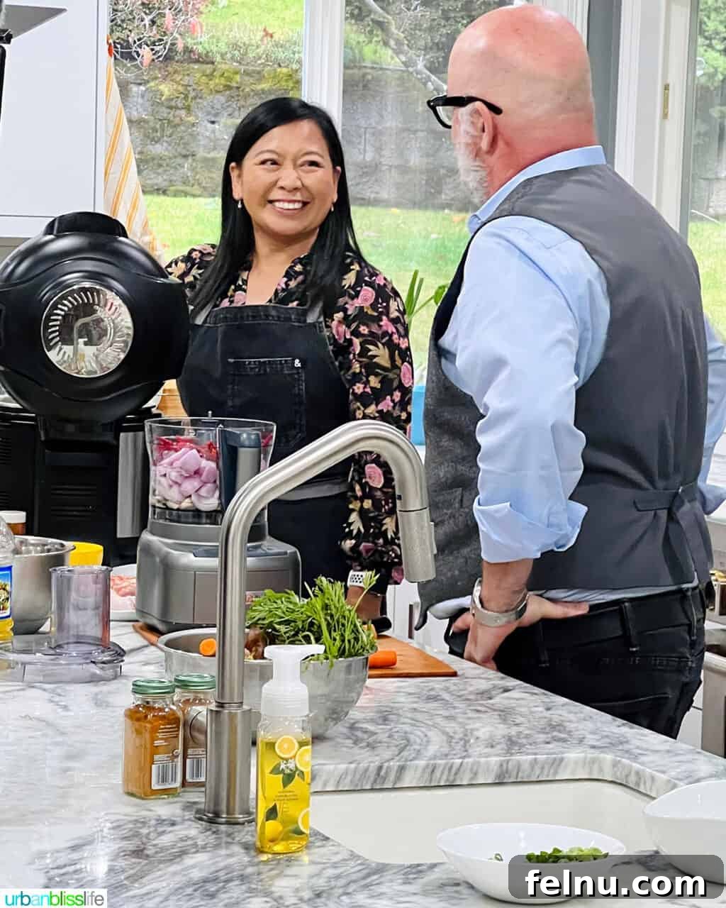 Dinner with the Jayme-Schotlands 6 Marlynn and Chef Andrew Zimmern sharing a lighthearted moment and conversation during the Family Dinner TV show filming in our home.