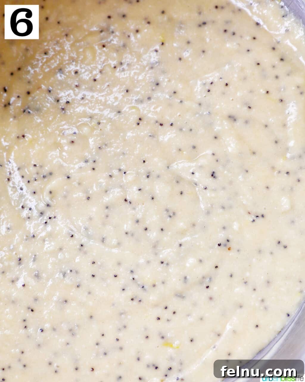 Lemon Poppy Seed Dream Cupcakes 12 lemon poppyseed cupcake batter in a bowl.