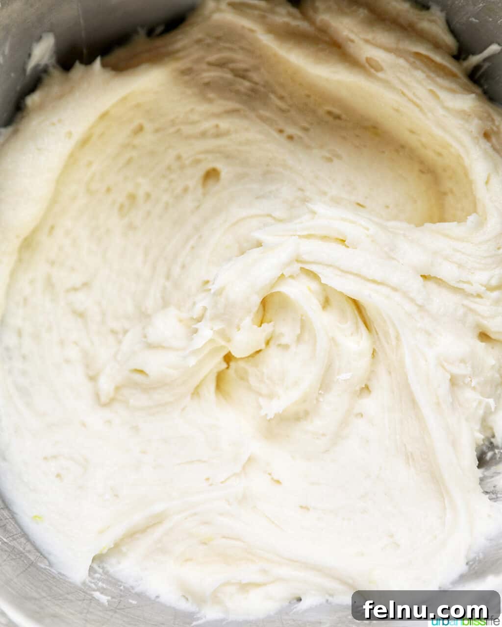 Lemon Poppy Seed Dream Cupcakes 15 Lemon buttercream frosting in the bowl of a stand mixer.