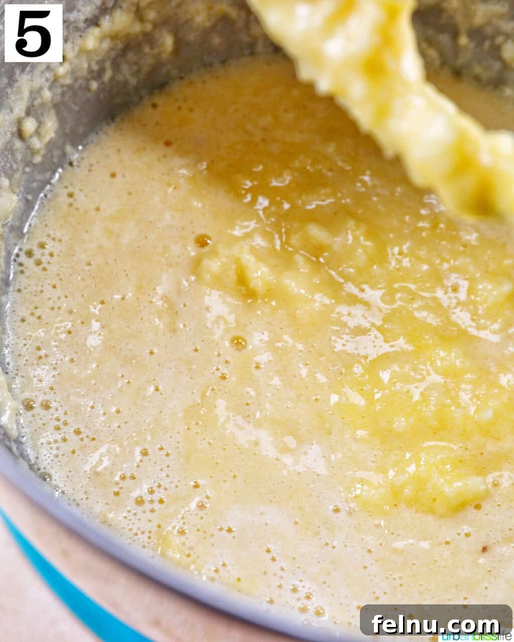 Lemon Poppy Seed Dream Cupcakes 10 Wet ingredients for cupcake batter mixing in a stand mixer with paddle attachment.