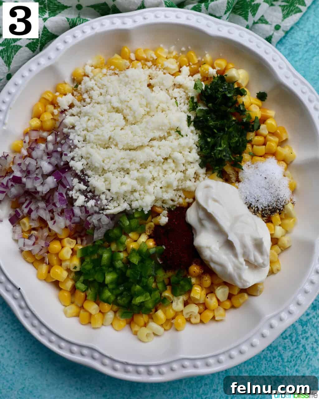 Mexican Street Corn Fiesta Dip 7 All the vibrant ingredients for Elote Dip mixed thoroughly in one large bowl, showcasing its creamy texture and colorful components.