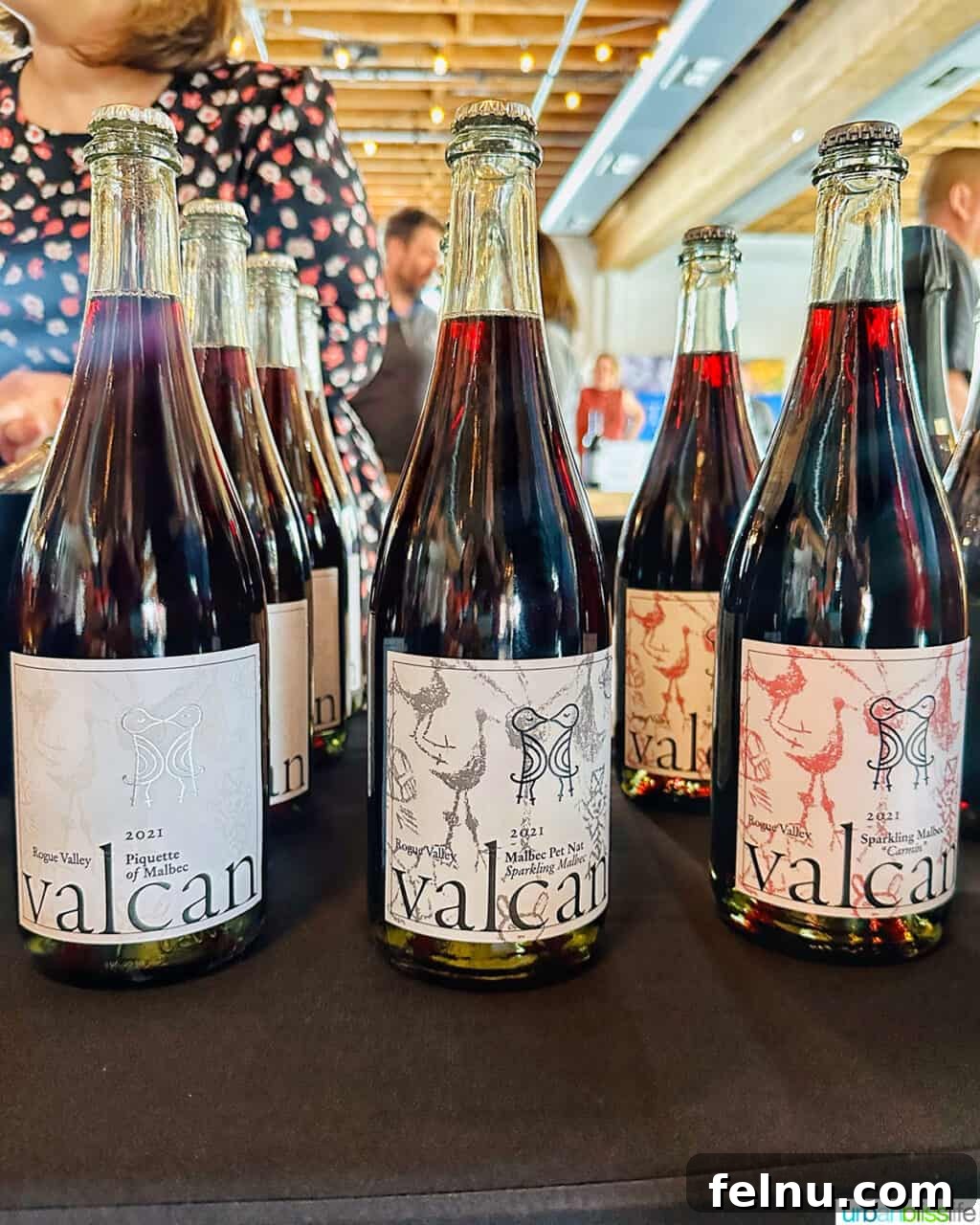 Malbec Takes Root: Oregon's Unexpected Wine Story 7 Wine bottles of Valcan Cellars wines on a table.