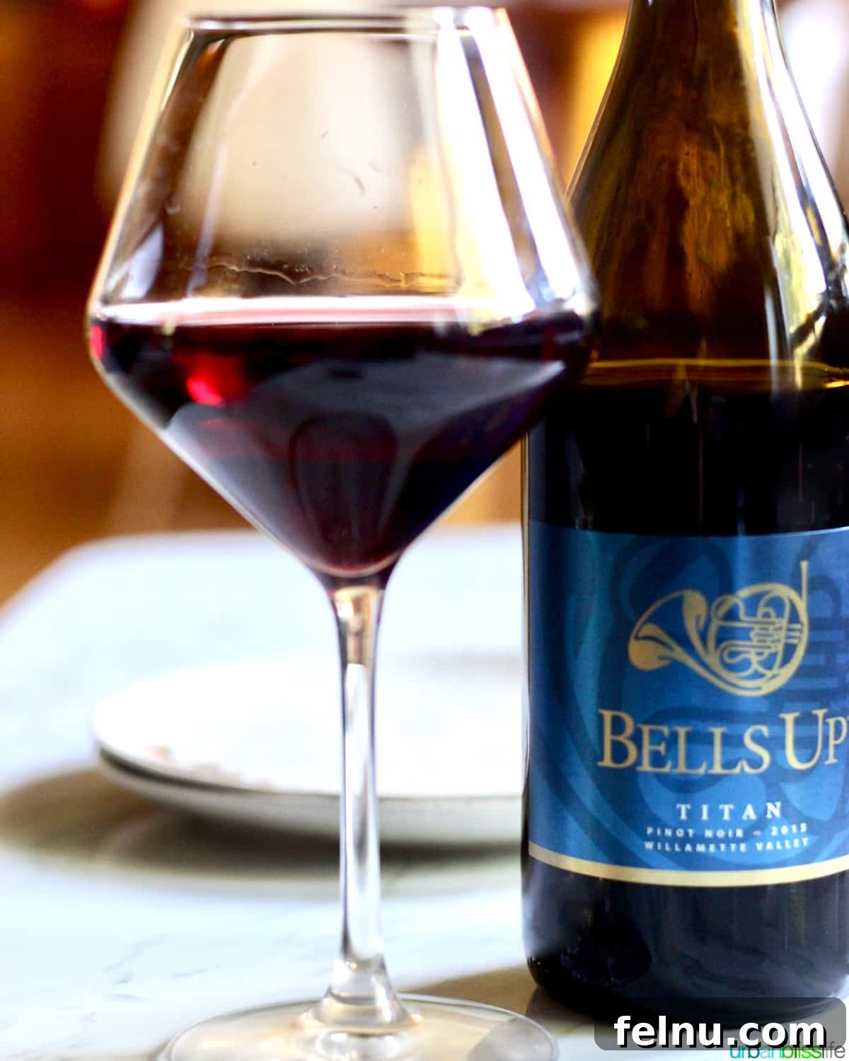 Uncorking Pasta Perfection 14 glass of red wine next to a bottle of Bells Up Winery pinot noir.