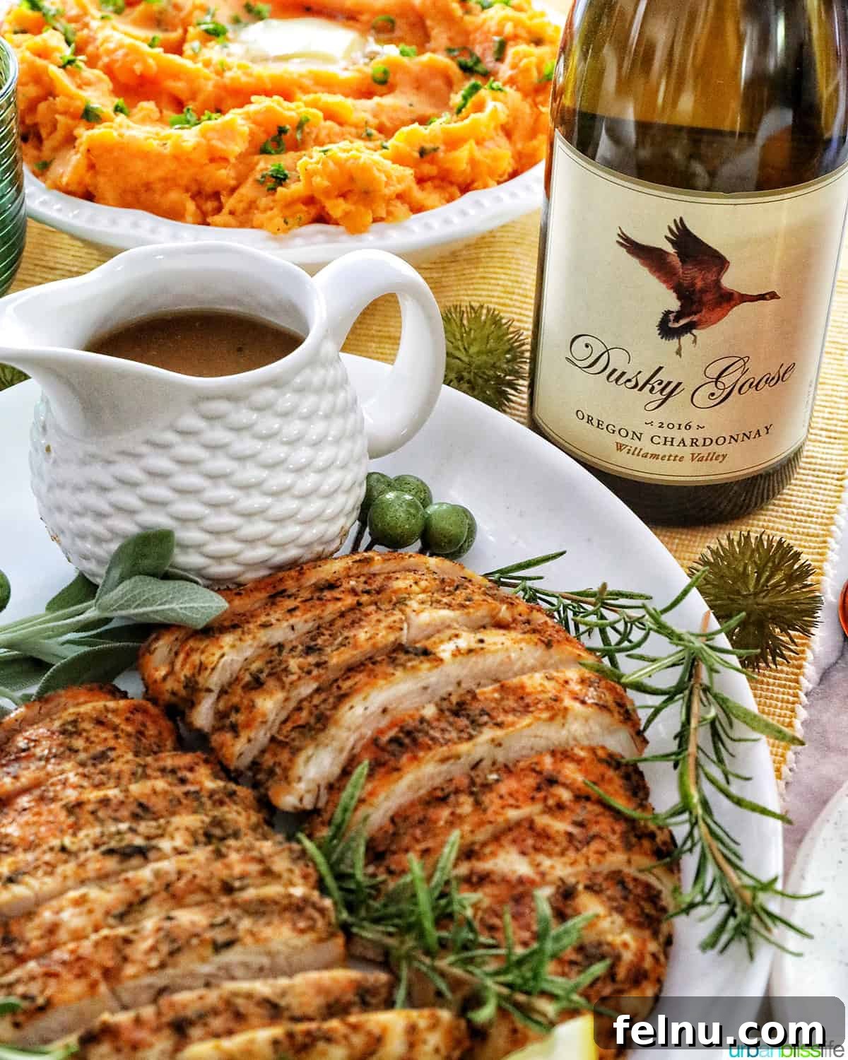 The Perfect Pairing: Wine and Turkey 4 A delectable plate of sliced turkey tenderloin, accompanied by gravy and sweet potatoes, paired with a bottle of Chardonnay.