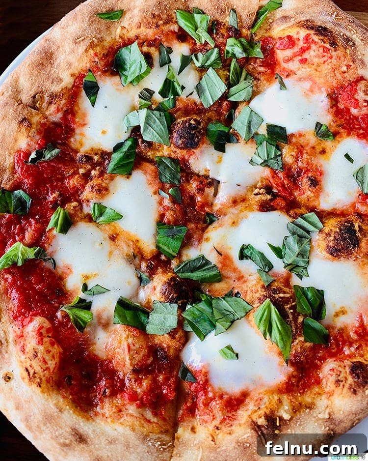 Pairing Pizza Perfection: The Ultimate Wine Guide 4 A beautifully crafted Margherita pizza, showcasing its fresh ingredients and simple elegance.
