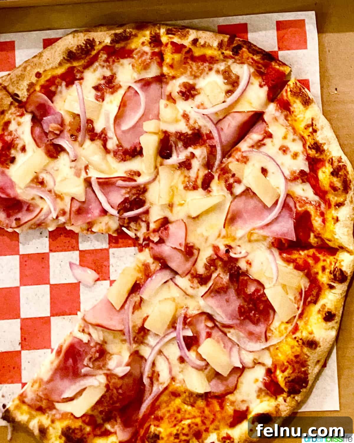 Pairing Pizza Perfection: The Ultimate Wine Guide 7 A Hawaiian pizza, showcasing the sweet pineapple, salty ham, and savory cheese combination.