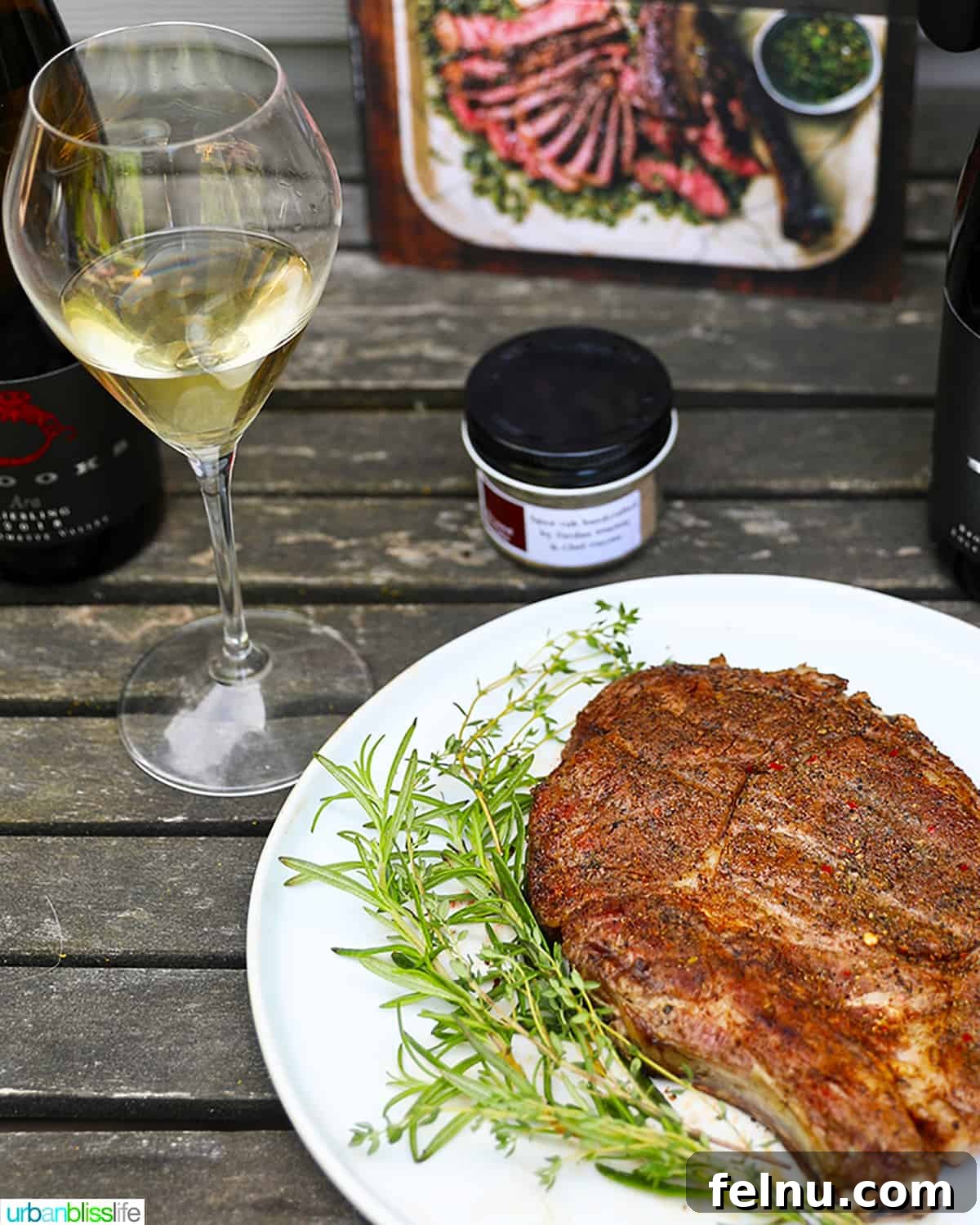 The Art of Steak and Wine Pairing 4 A pristine glass of white wine placed delicately beside a perfectly cooked steak, suggesting an unconventional yet sophisticated pairing.