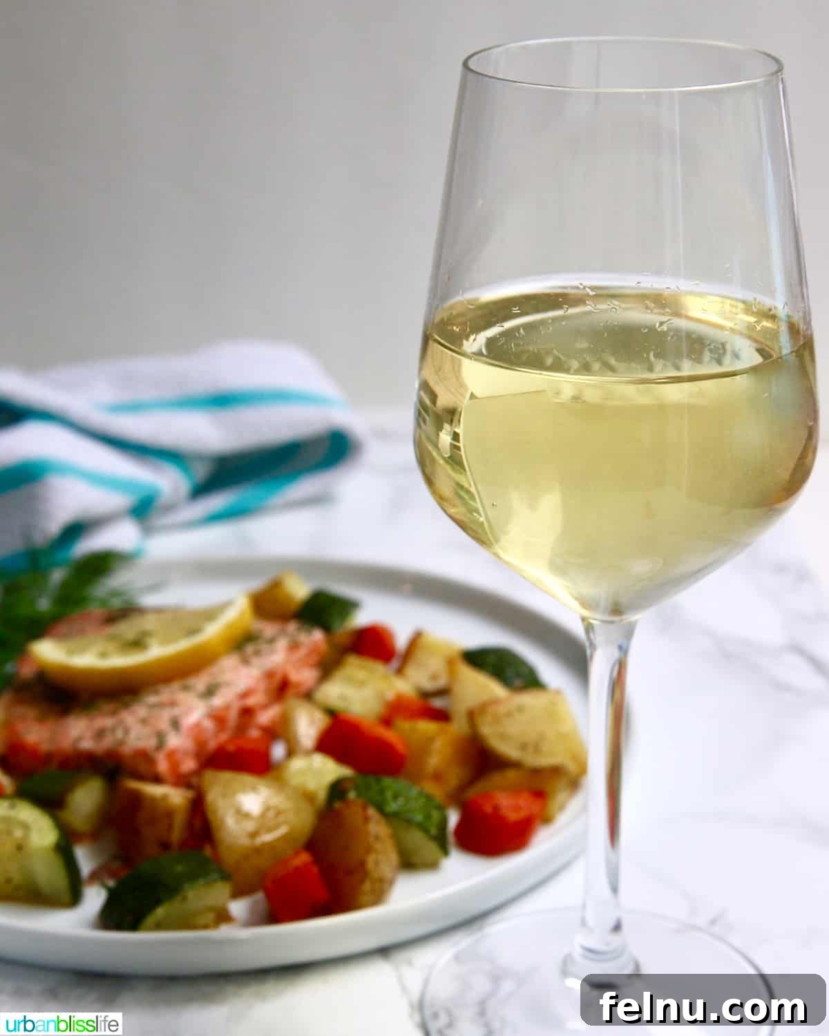 The Perfect Pairing: Wine and Salmon 6 Glass of white wine with salmon and vegetables