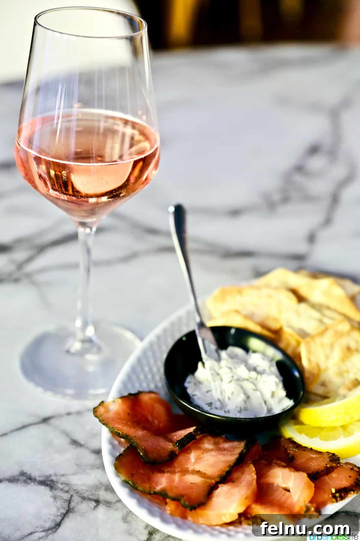 The Perfect Pairing: Wine and Salmon 7 Plate of smoked salmon and dip with a glass of rosé wine