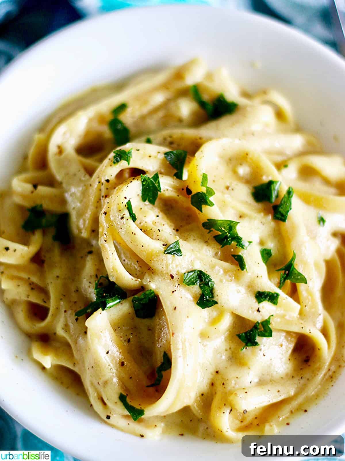 Chardonnay's Culinary Companions 9 A delectable bowl of dairy-free fettuccine alfredo, showcasing its creamy texture.