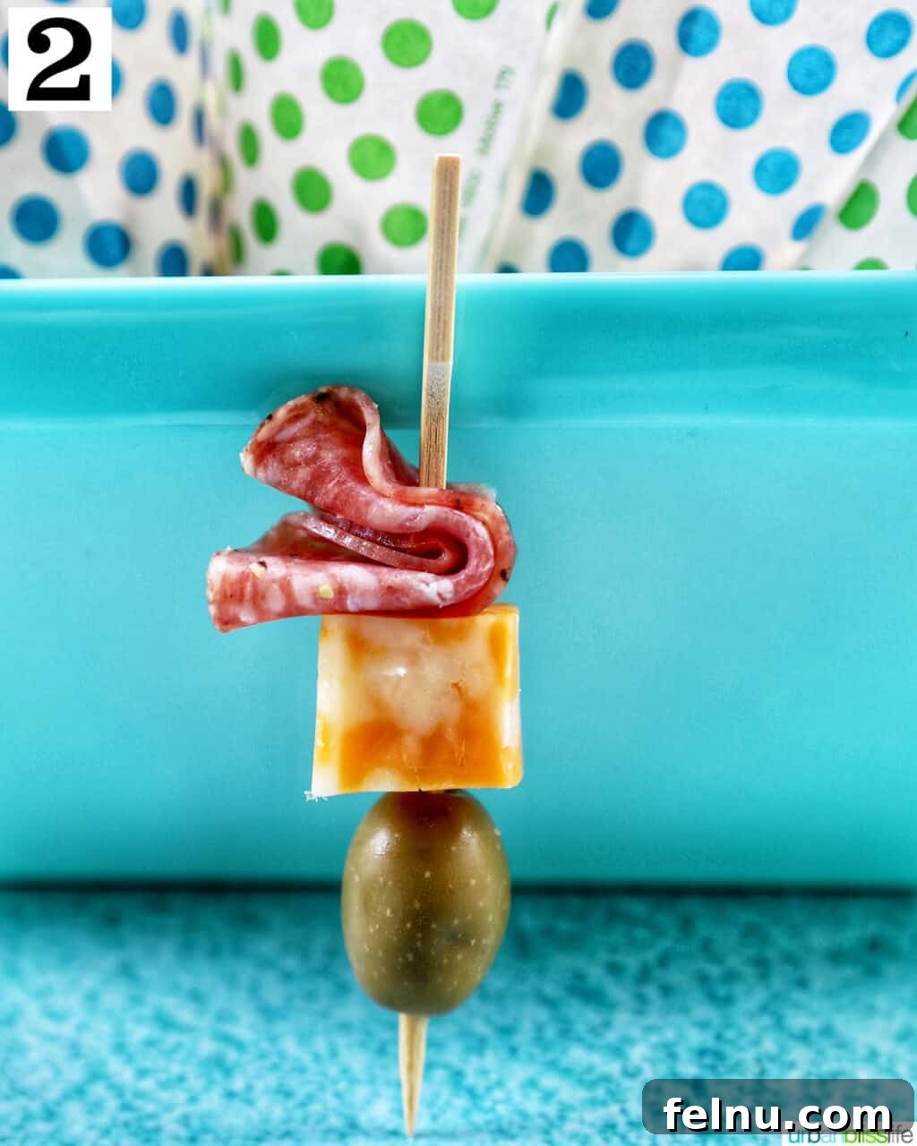 Charcuterie on the Go 7 Food skewer with salami, cheese, and olives.