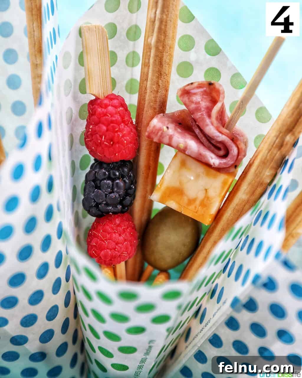 Charcuterie on the Go 9 Charcuterie cone being filled with savory and sweet skewers.
