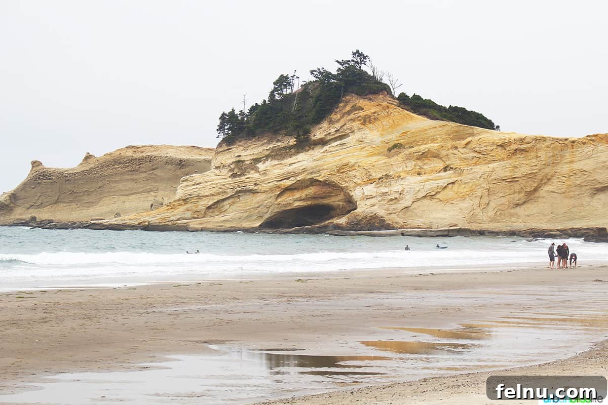 Quintessential Oregon Coast Towns 9 Sand dune and sandy beach and Pacific Ocean at Pacific City, Oregon.