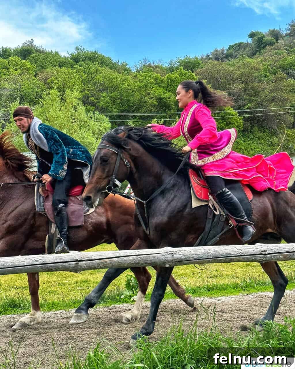 Explore Almaty: Thirty Unforgettable Things to Do 26 A man and woman gracefully ride horses at the Ethno Village of the Huns near Almaty, Kazakhstan, depicting nomadic traditions.