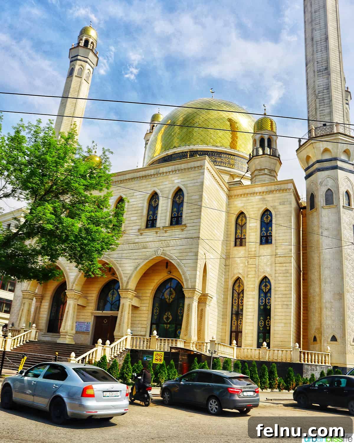 Explore Almaty: Thirty Unforgettable Things to Do 34 The stunning exterior of a grand Kazakhstan mosque in Almaty, featuring intricate details and a golden dome.