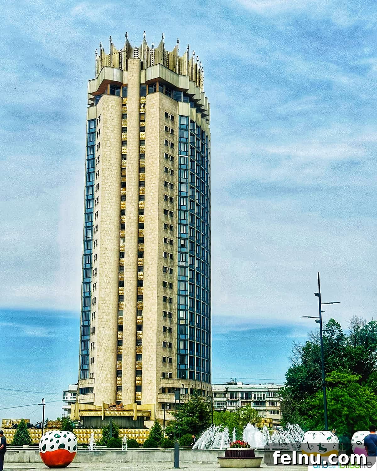Explore Almaty: Thirty Unforgettable Things to Do 44 The imposing and grand Kazakhstan Hotel in Almaty, showcasing a prominent example of Soviet architecture.