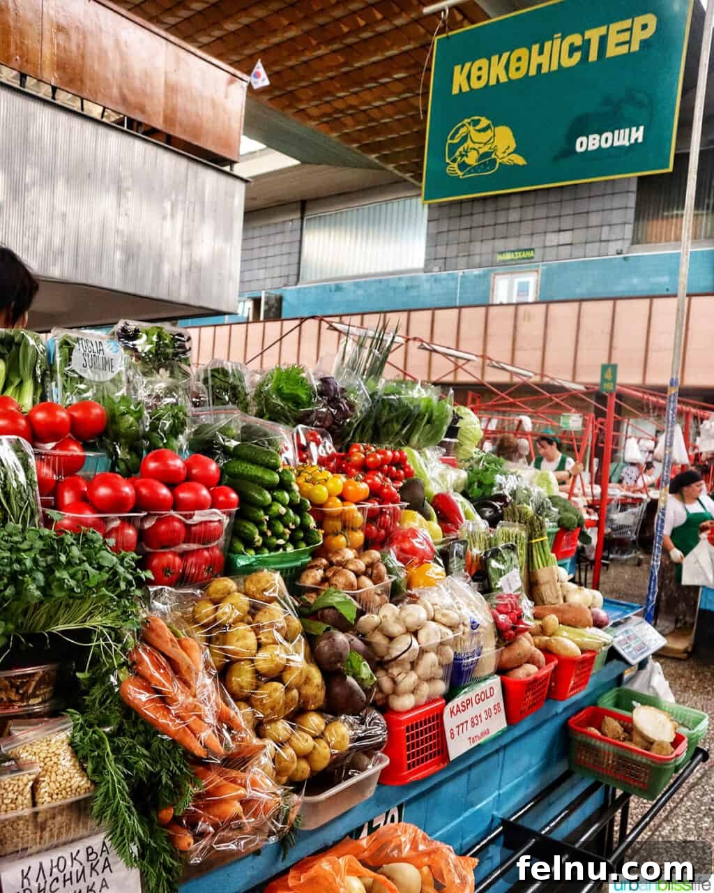 Explore Almaty: Thirty Unforgettable Things to Do 6 Fresh, colorful produce artfully arranged at the Green Bazaar in Almaty, Kazakhstan, inviting shoppers to explore local flavors.