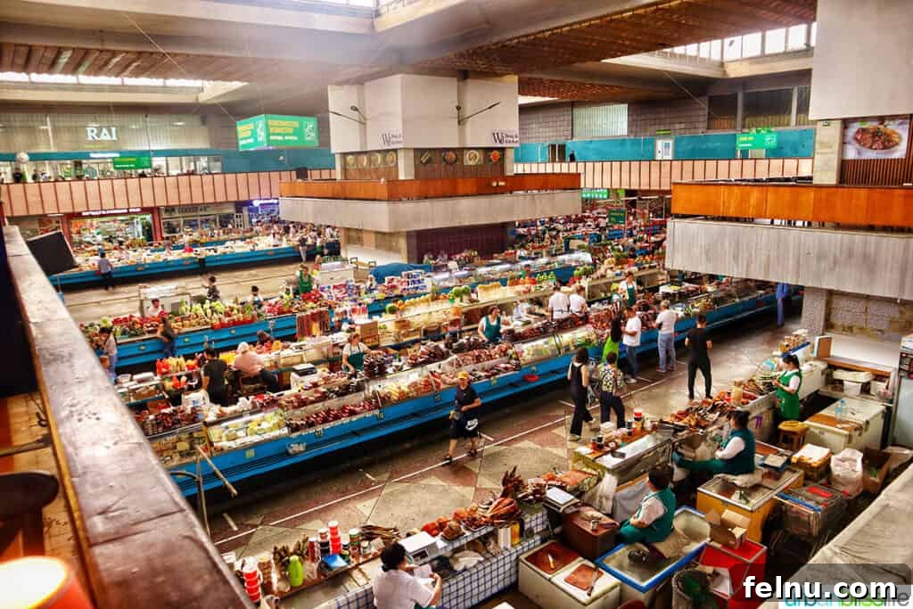 Explore Almaty: Thirty Unforgettable Things to Do 7 A wide overhead view of the vibrant and expansive Green Bazaar in Almaty, Kazakhstan, bustling with activity.