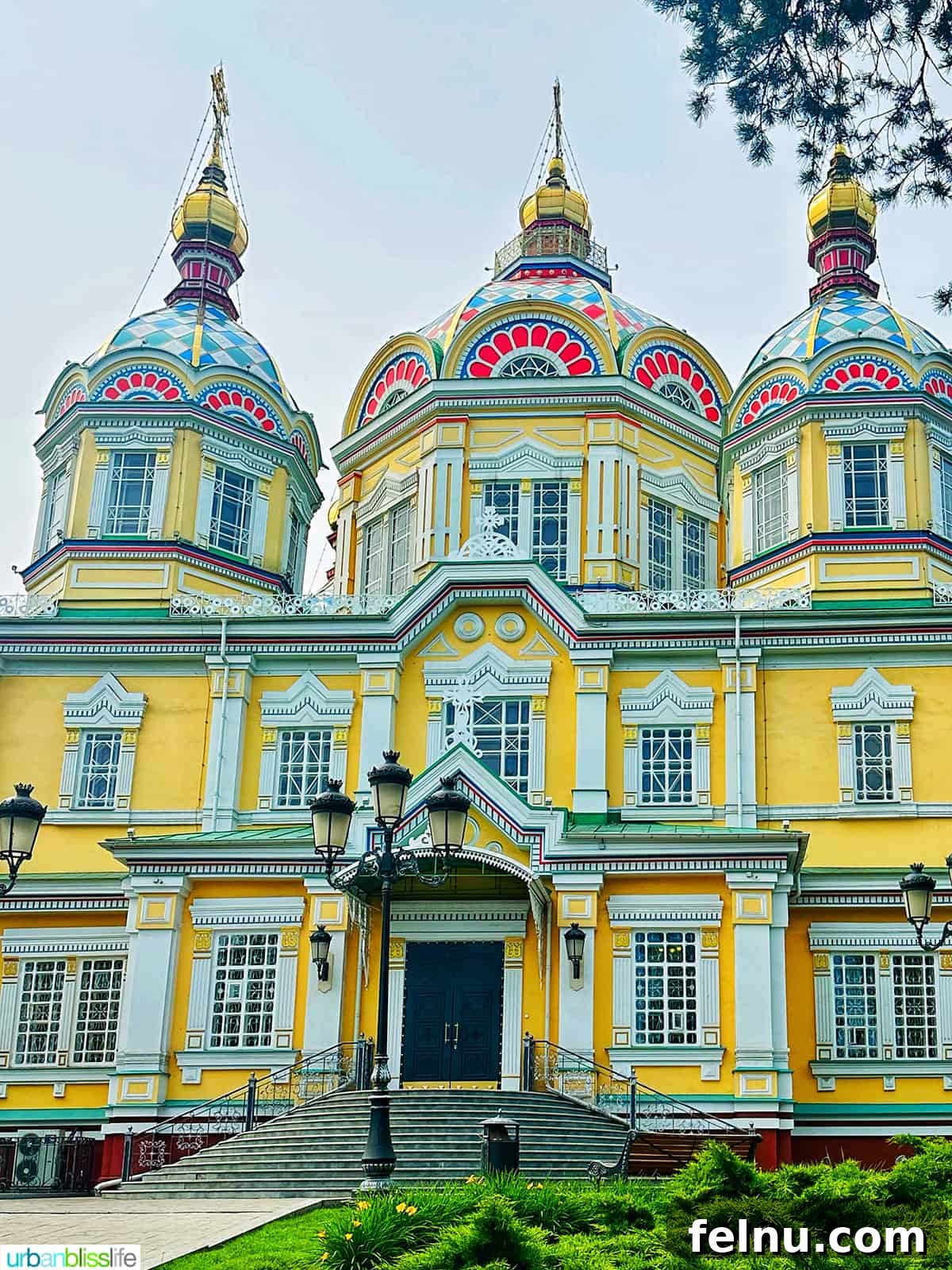 Explore Almaty: Thirty Unforgettable Things to Do 8 The stunning, vibrantly colored wooden exterior of Zenkov Cathedral in Almaty, Kazakhstan, a unique architectural marvel.
