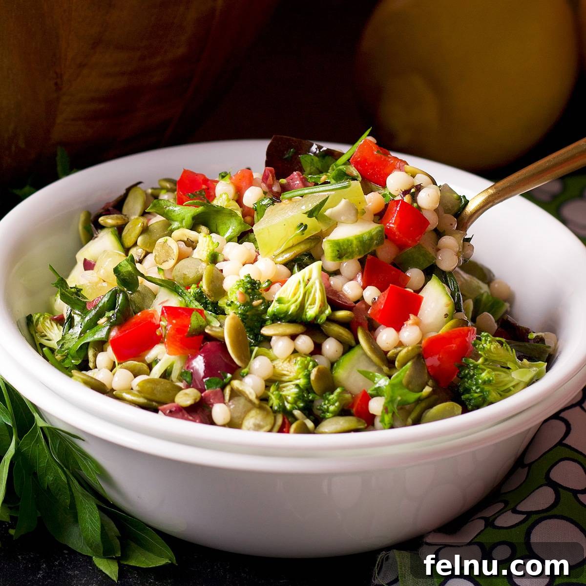 Vegan pearl couscous salad with fresh veggies.