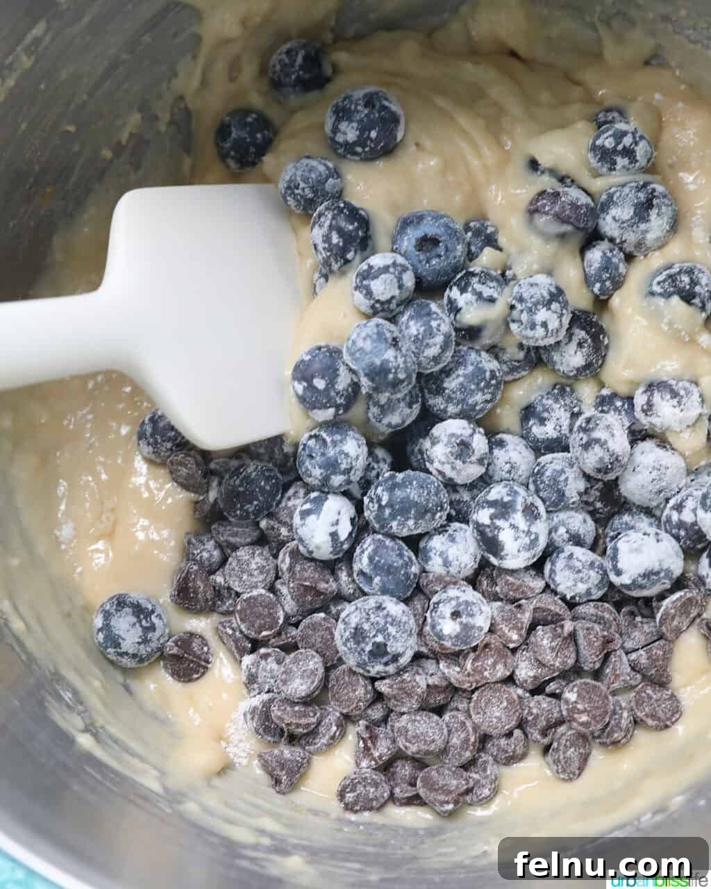 Blueberry Chocolate Chunk Muffins 12 Gently folding blueberries and chocolate chips into the batter