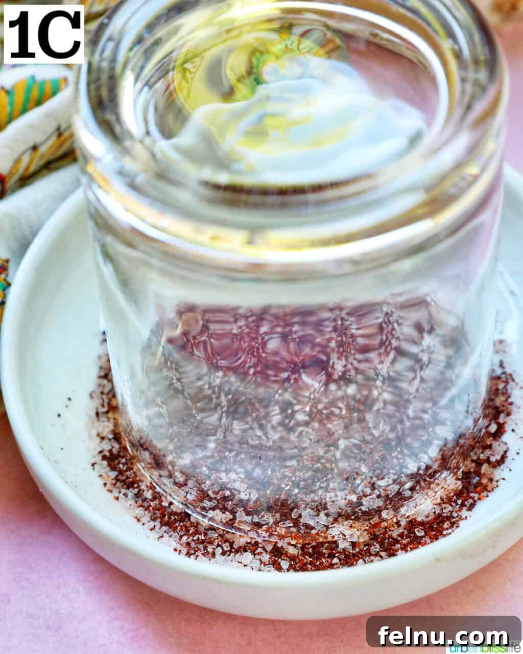 Spicy Mango Tango 7 Dipping Glass into Chili Powder Salt