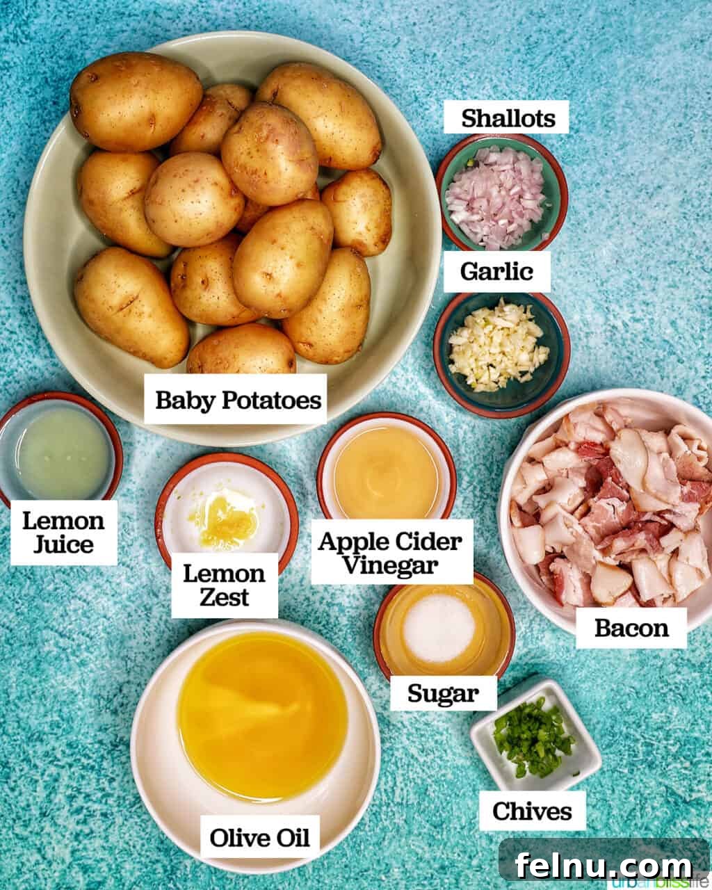 Creamy Baby Potato Salad with Crispy Bacon 3 ingredients to make baby potato salad with bacon laid out on a kitchen counter