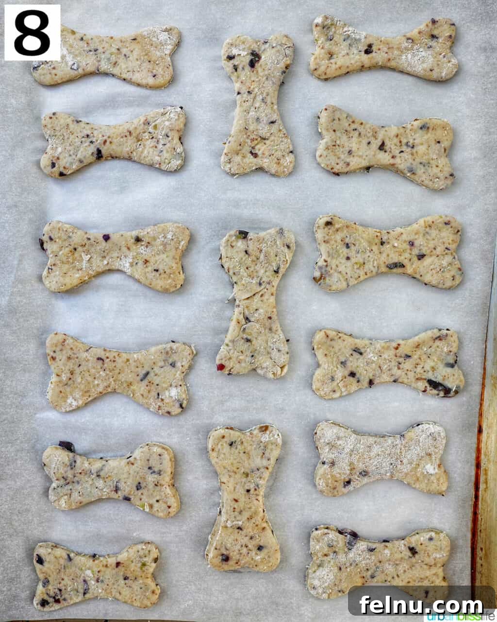 Happy Hound Blueberry Treats 12 Step 8: Cut-out dog treats placed on a baking sheet.