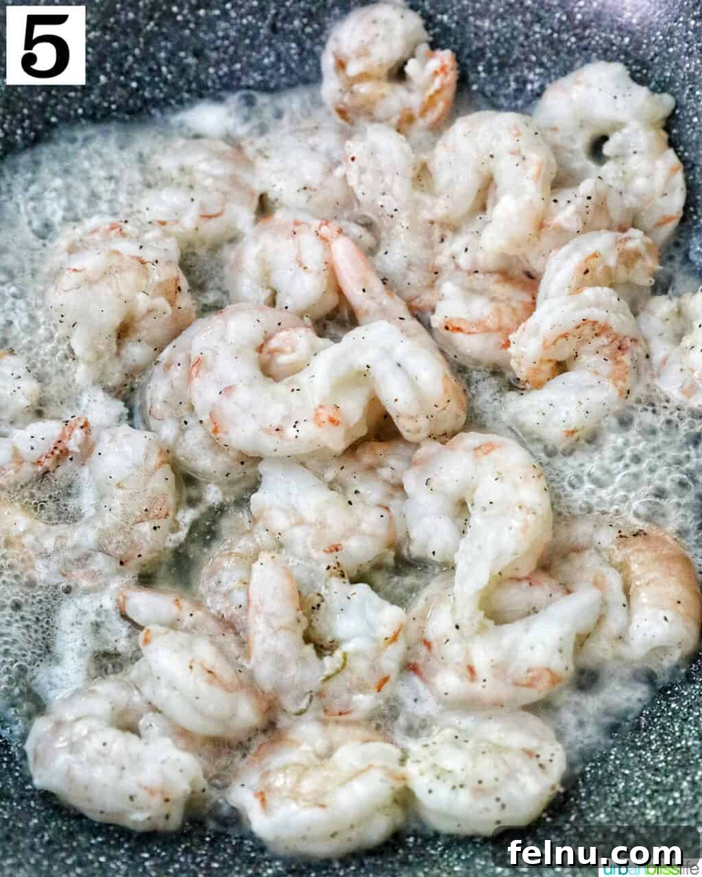 Homemade Prawn Chow Mein Delight 12 Succulent prawns sizzling and cooking in a hot wok, changing color as they cook.