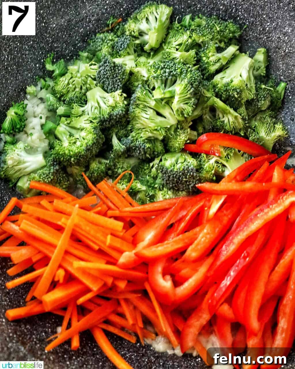 Homemade Prawn Chow Mein Delight 14 A colorful mix of chopped broccoli, julienned carrots, and diced red bell peppers stir-frying in a hot wok.