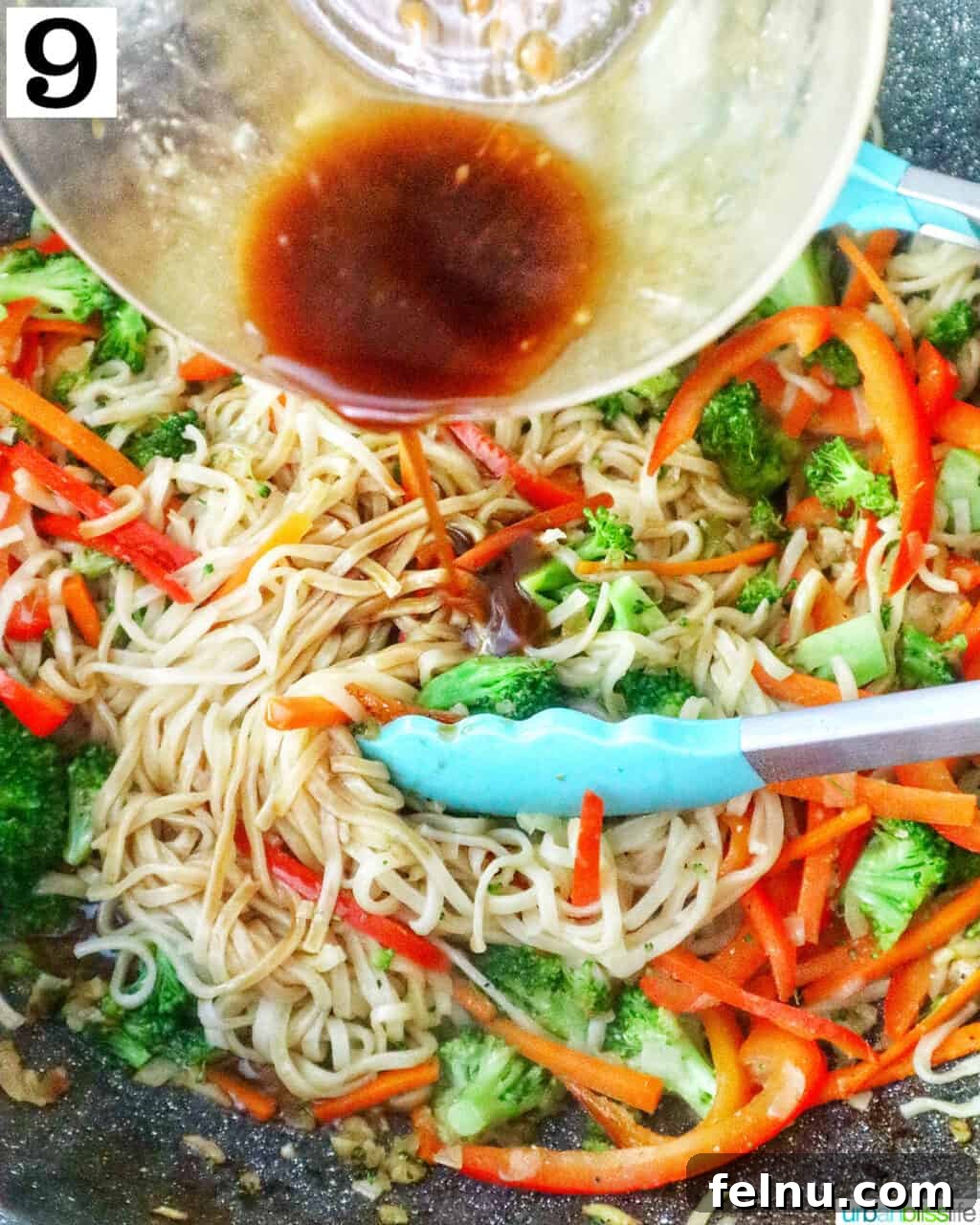 Homemade Prawn Chow Mein Delight 16 A bowl of the prepared chow mein sauce being poured over the noodles and vegetables in a wok.