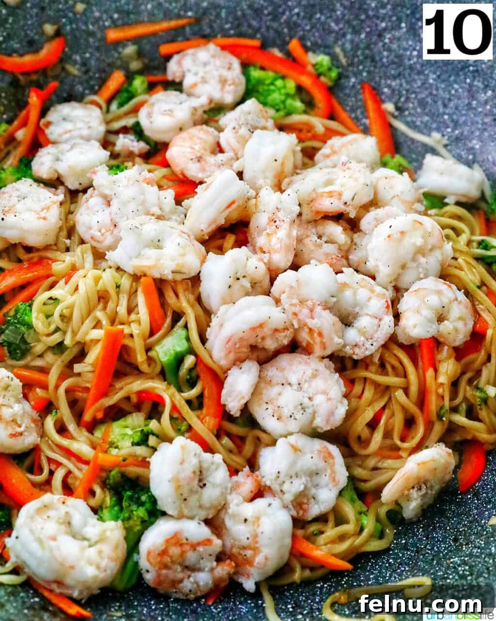 Homemade Prawn Chow Mein Delight 17 The finished Prawn Chow Mein stir-frying in the wok, with all ingredients coated in sauce.
