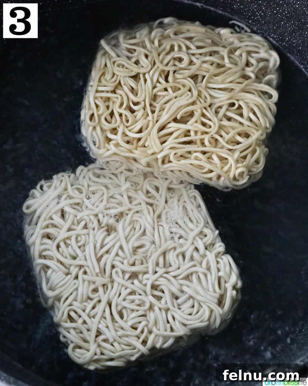 Homemade Prawn Chow Mein Delight 10 Egg noodles being parboiled in a pot of boiling water, preparing them for the stir-fry.