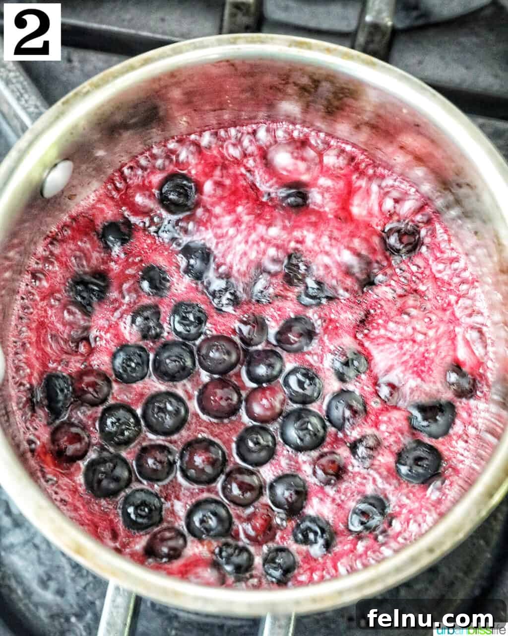 Blueberry Bliss Toast 6 Blueberries simmering in a saucepan, forming a compote.