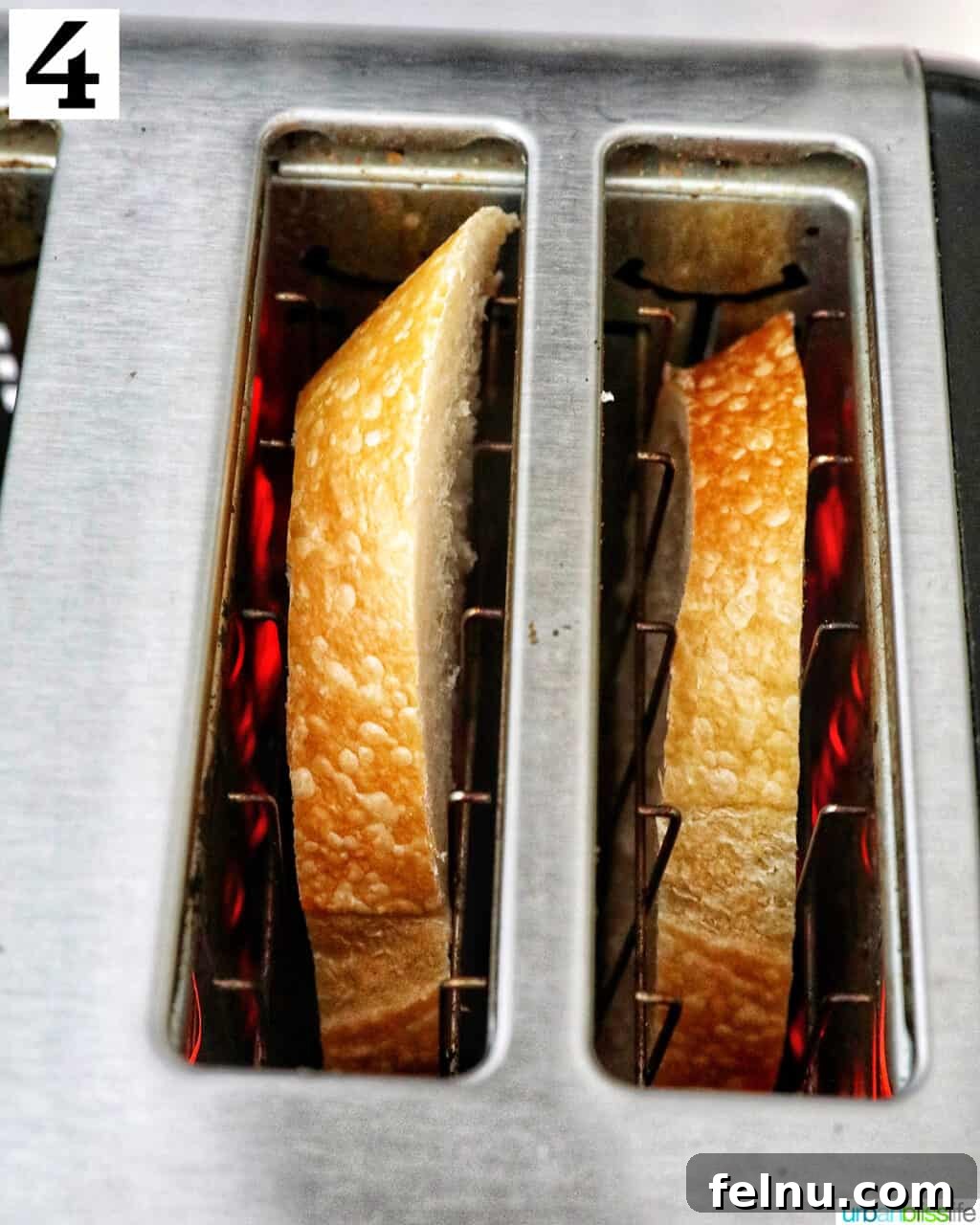 Blueberry Bliss Toast 8 Two slices of French bread toasting in a toaster oven, turning golden brown.