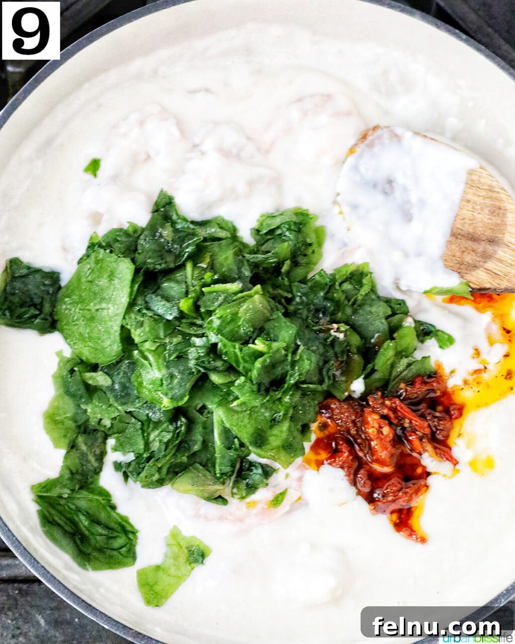 Tuscan Shrimp Gnocchi Delight 14 Spinach and sun-dried tomatoes being added to the sauce.