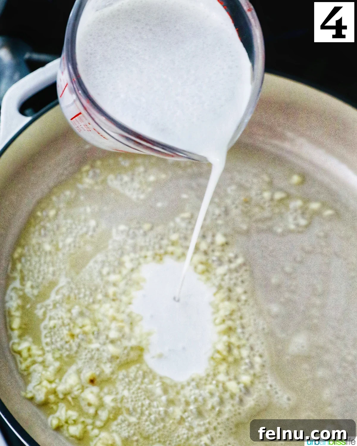 Tuscan Shrimp Gnocchi Delight 8 Cream being poured into the skillet.