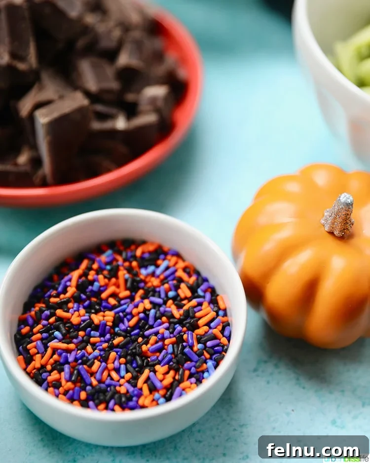 17 Spooktacularly Healthy No-Bake Halloween Treats 3 Close-up shot of Monster Halloween Bark with colorful sprinkles.