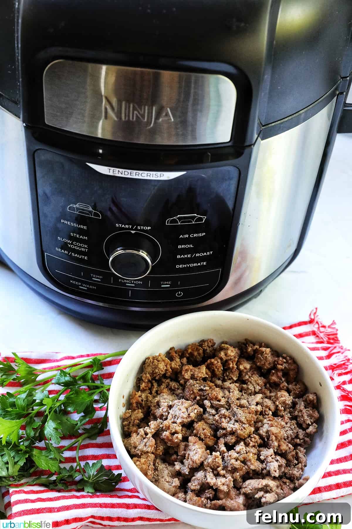Air Fryer Ground Beef Dishes 24 Air fryer and ground beef in a white bowl.
