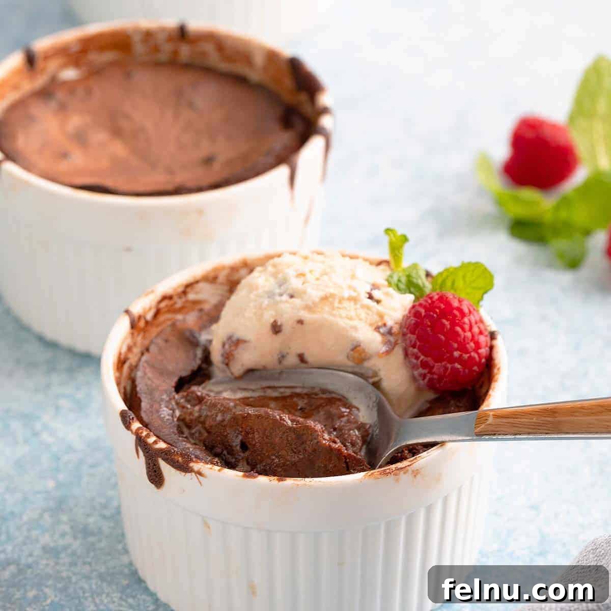 Decadent Air Fryer Lava Cake with a molten chocolate center, topped with ice cream.