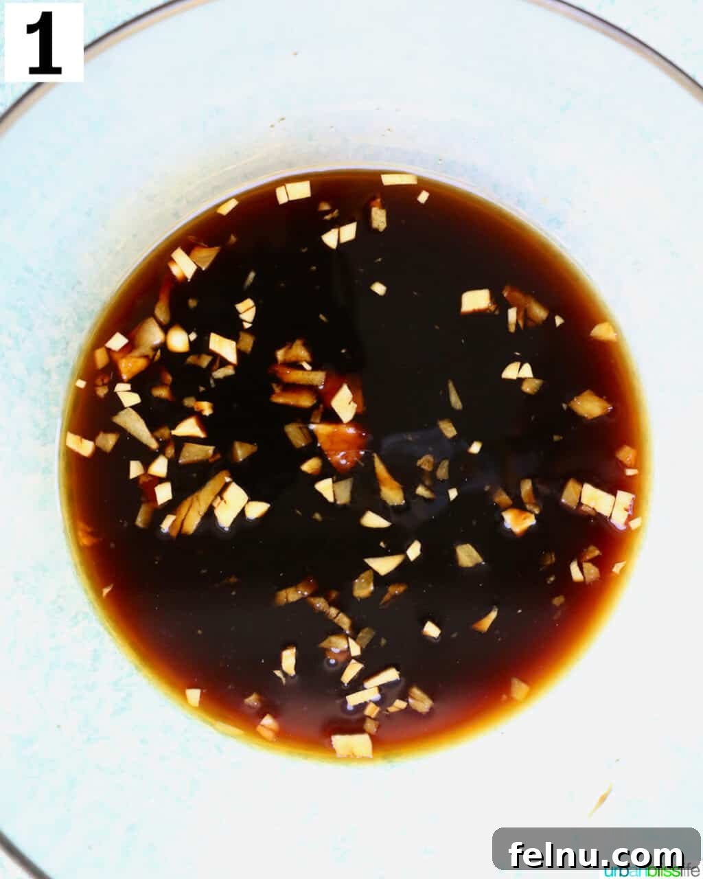 Flavorful Teriyaki Ground Turkey Stir-Fry 6 A bowl of freshly prepared teriyaki sauce, ready to be added to the ground turkey mixture.