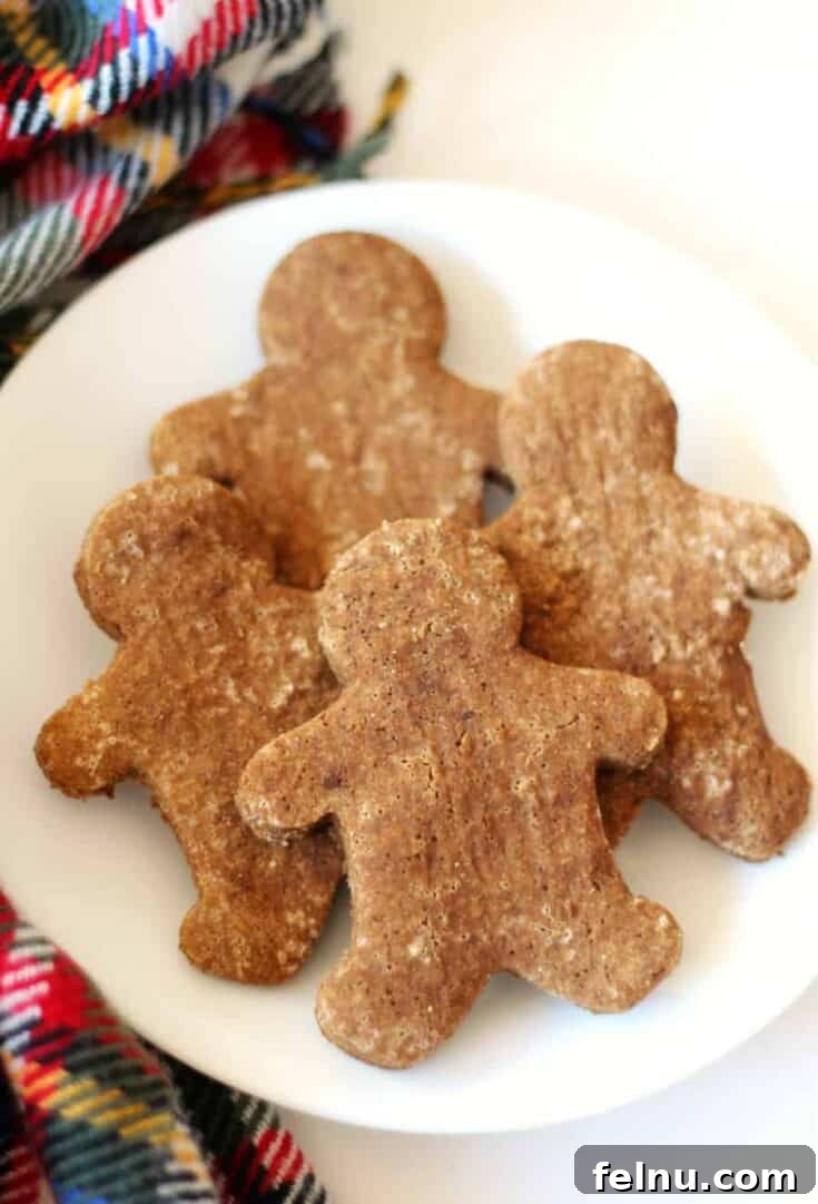 Classic gluten-free vegan gingerbread men cookies decorated for Christmas.