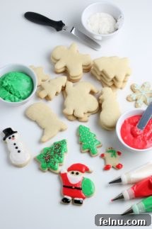 Colorful vegan Christmas sugar cookies, cut into festive shapes and decorated.