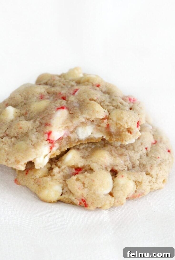 Gluten-free vegan white chocolate peppermint cookies with white chocolate chips and crushed peppermint candies.