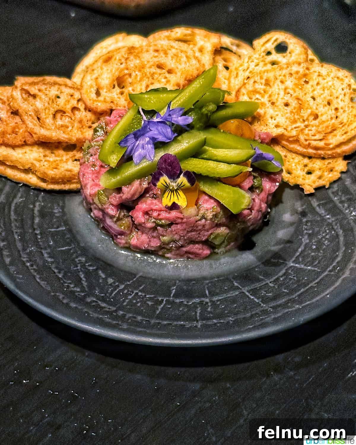 Beef tartare with crostini chips at Bar Oso.