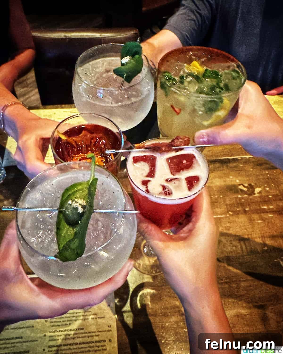 A celebratory cheers with cocktails at the Raven Room.